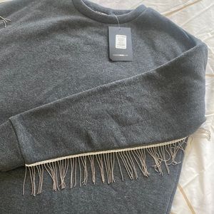This is a fun and stylish sweatshirt ,great material and feels warm